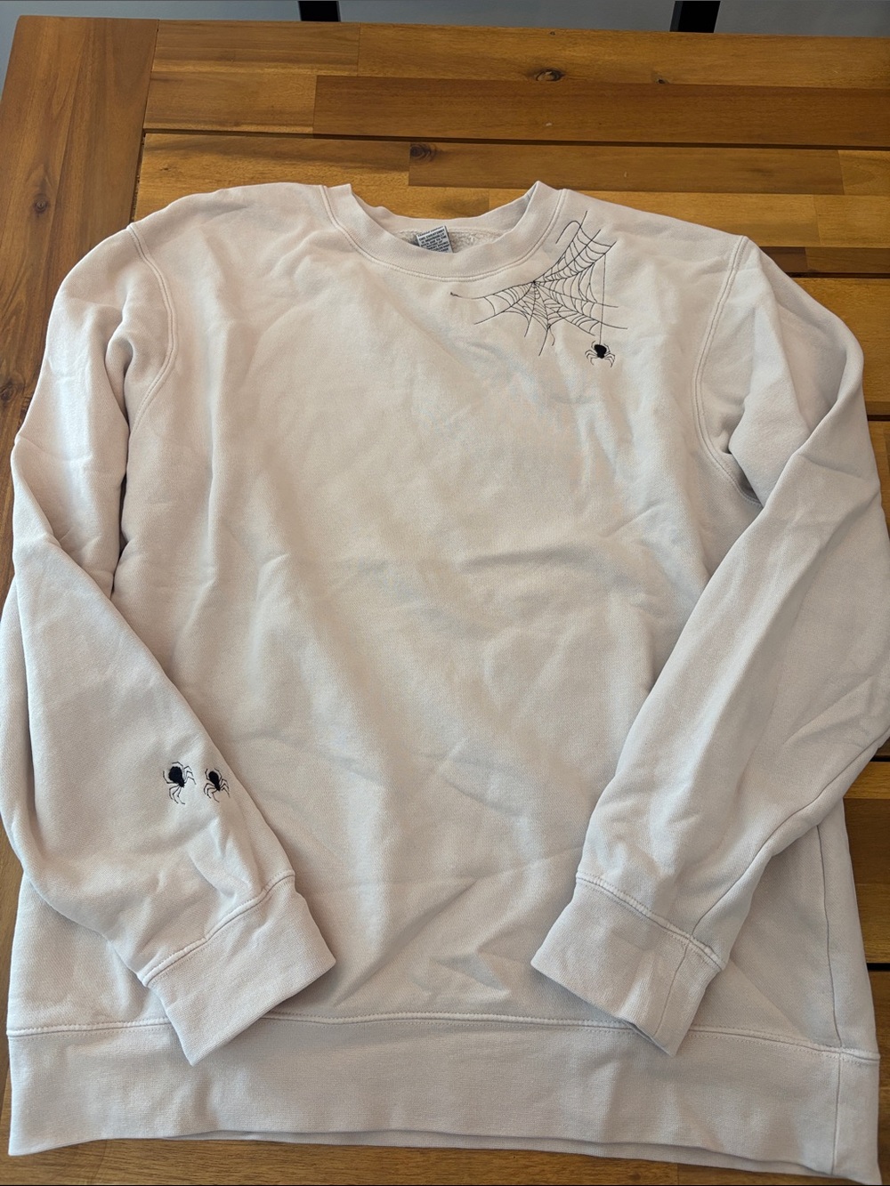 Women's beige crewneck sweatshirt with spider embroidery